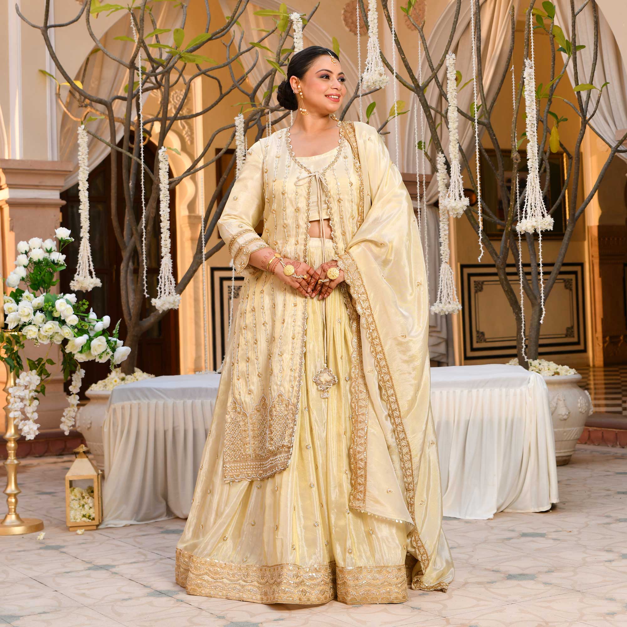 TAAJ- Ivory & Gold Cutdana Embroidered Lehenga Set with Cape