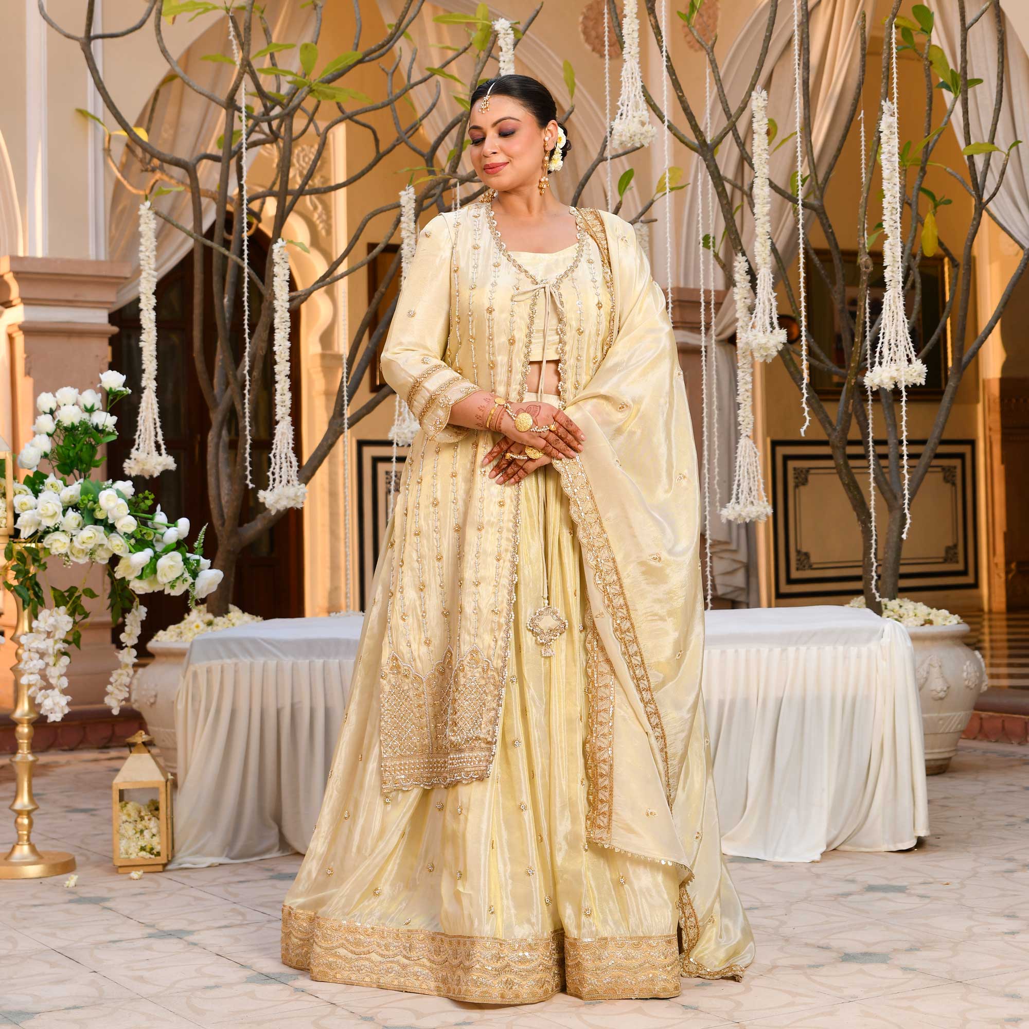 TAAJ- Ivory & Gold Cutdana Embroidered Lehenga Set with Cape