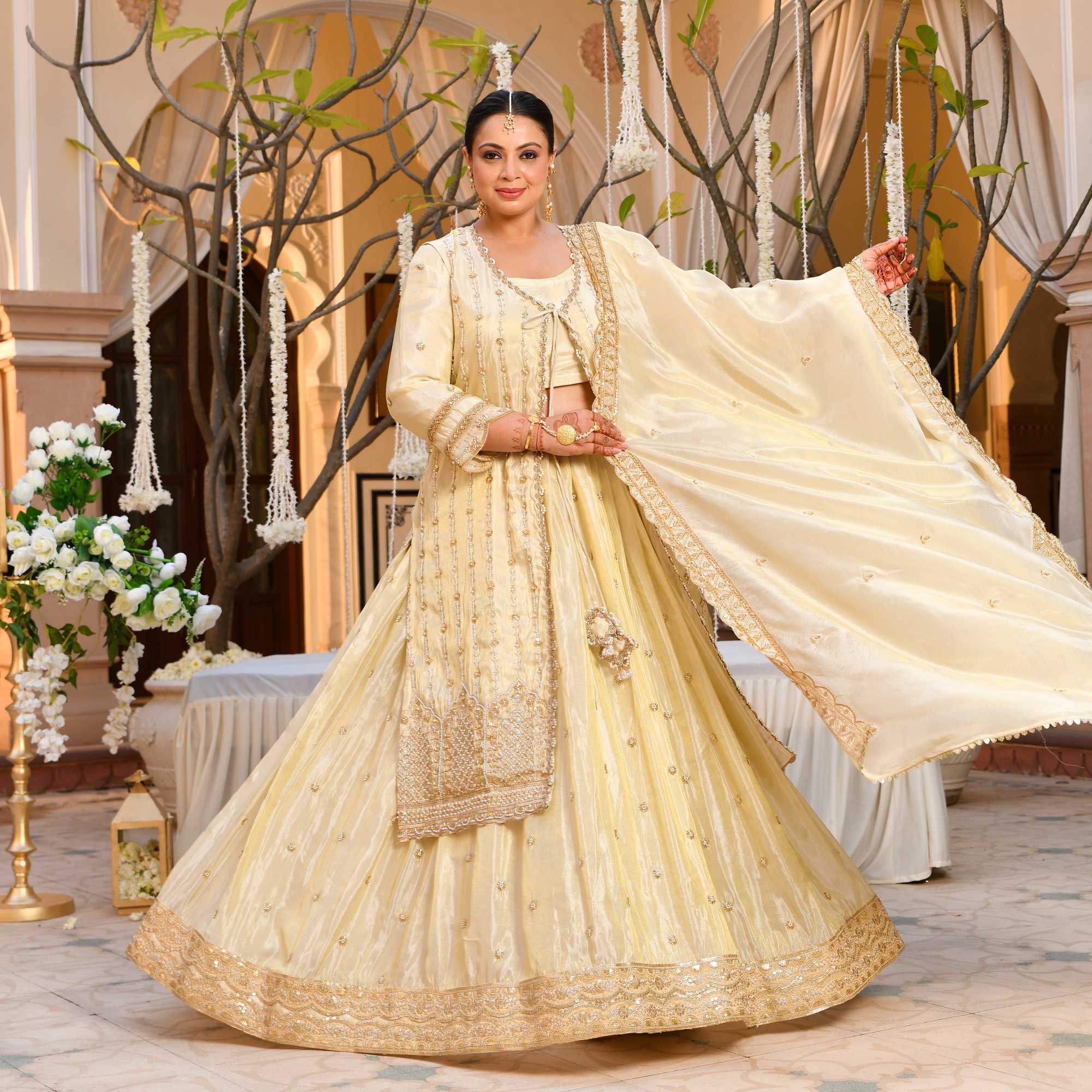 TAAJ- Ivory & Gold Cutdana Embroidered Lehenga Set with Cape